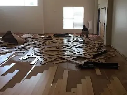 Flooring lifting off a concrete slab where a hidden pipe leak soaked through